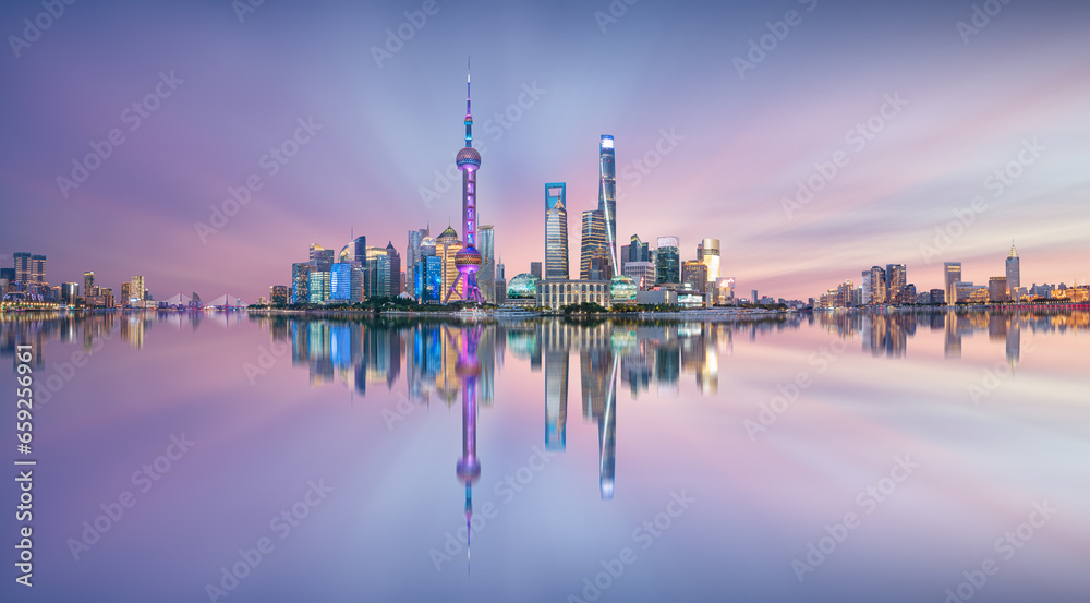Illuminated Shanghai Skyline Reflecting On River at night
