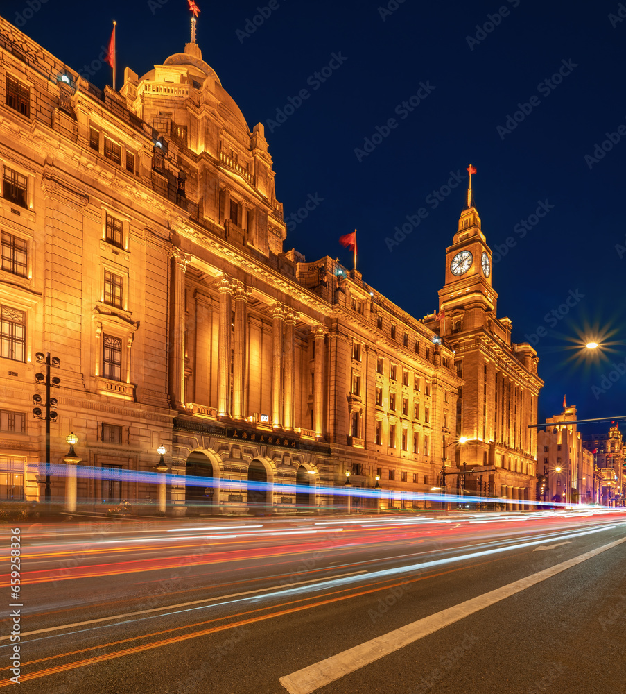 financial district of Shanghai and beautiful light trail at highway