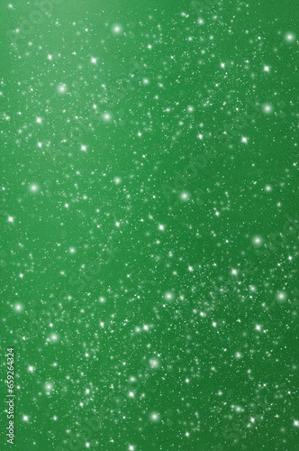 Abstract green sparkle background template with copy space.Christmas blur glitter bokeh festive backdrop.