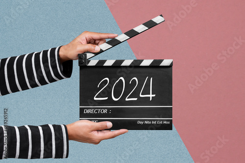 Film crew holding a clapperboard or film slate For filming the new story in year 2024. photo