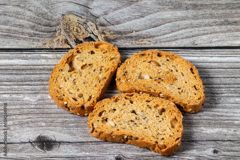 slices of toasted bread with seeds slices of toasted bread with seeds