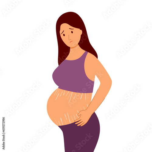 Sad depressed pregnant woman looking at pregnancy belly with stretch marks.