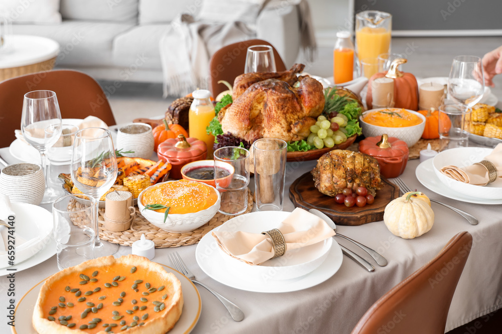 Festive table setting with tasty food for Thanksgiving Day in room, closeup Festive table setting with tasty food for Thanksgiving Day in room, closeup