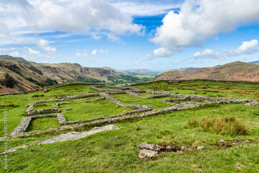 Fototapeta premium The remains of the Roman fort at Mediobogdum, Hardknott Pass , Cumbria, looking down Eskdale.