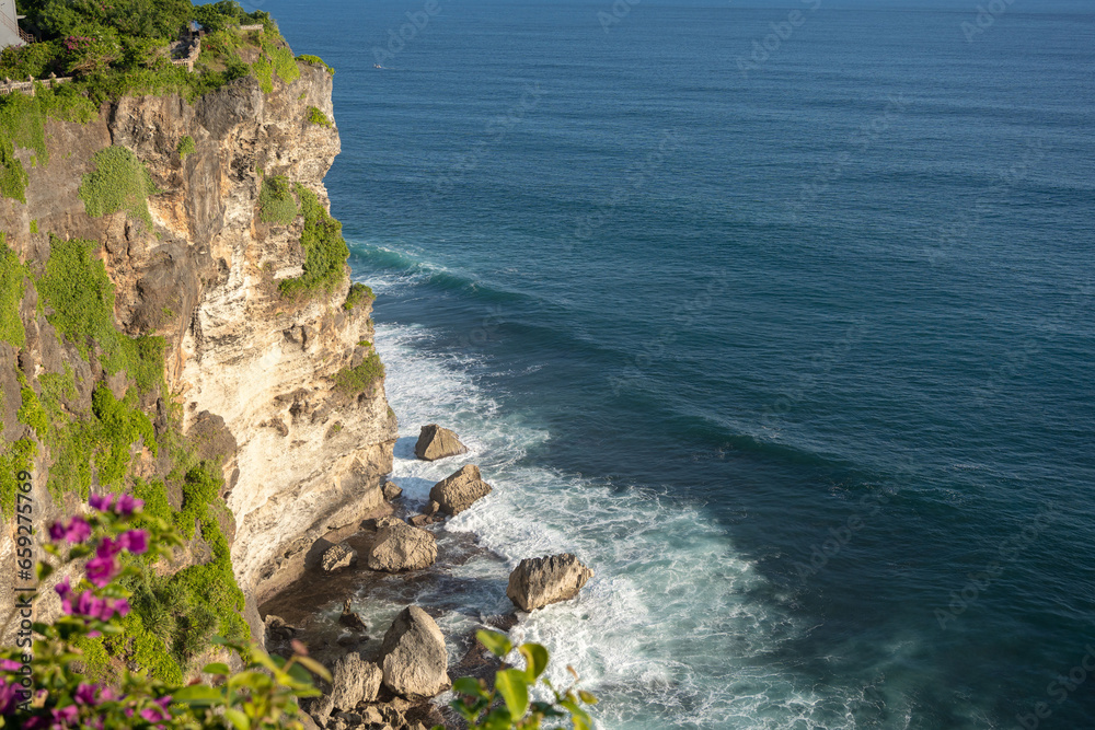 View of Uluwatu temple of top of the cliff, in Uluwatu, Bali, Indonesia, ocean landscape. 