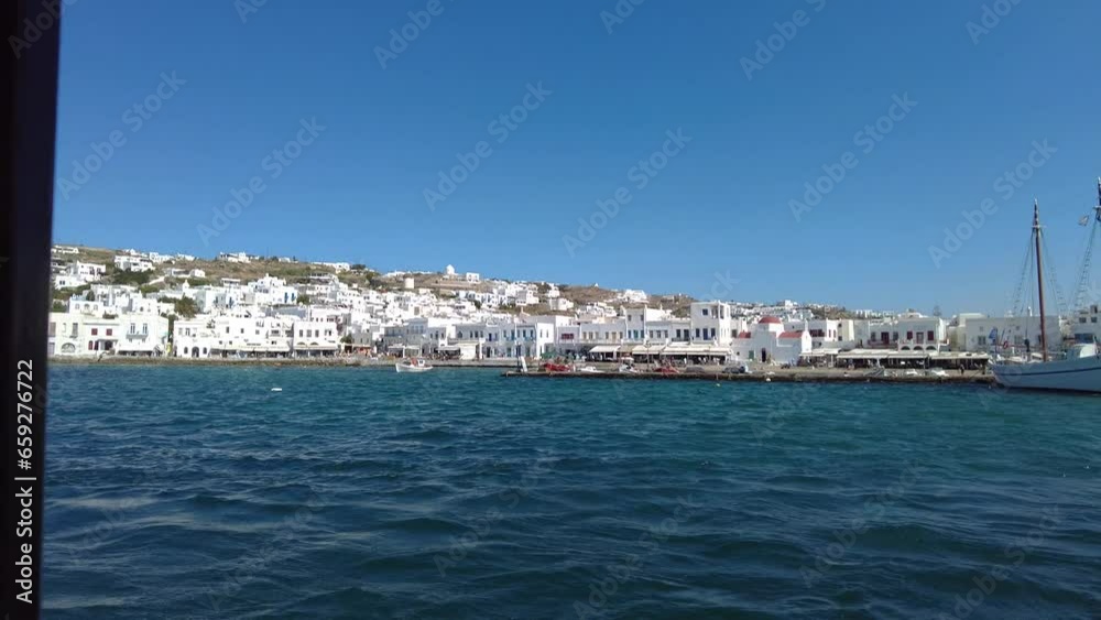 View of Mykonos Islands in Greece as seen from a moving boat. View of Mykonos Islands in Greece as seen from a moving boat.