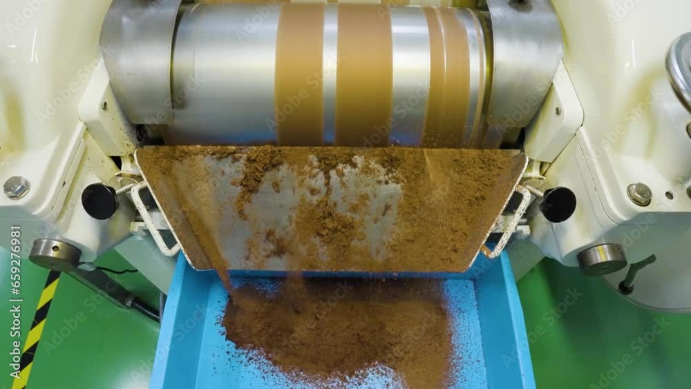 Close-up slow motion of chocolate refining process with roll cylinder machine, Malaysia Close-up slow motion of chocolate refining process with roll cylinder machine, Malaysia