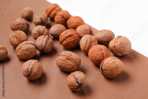 Whole walnuts on color background