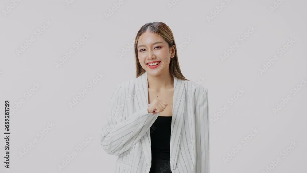 Portrait of woman wearing formal wear blazer white shirt smiling on gray background. Business concept. Portrait of woman wearing formal wear blazer white shirt smiling on gray background. Business concept.