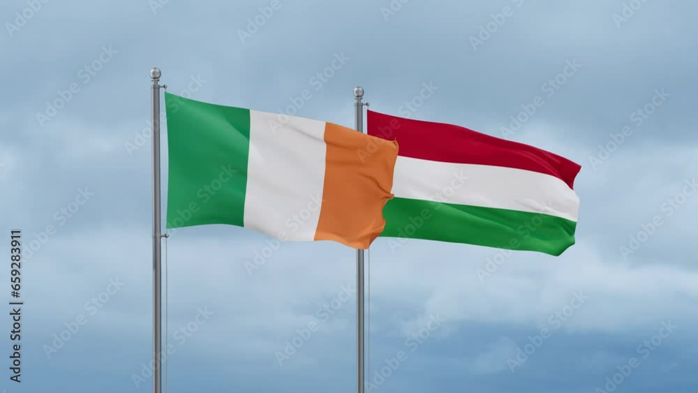 Hungary flag and Ireland flag waving together on cloudy sky, endless seamless loop, two country relations concept Hungary flag and Ireland flag waving together on cloudy sky, endless seamless loop, two country relations concept