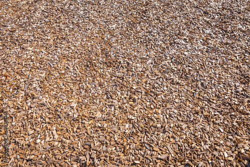 Woodchips used as safe soft surface for a playground or against weeds in a garden