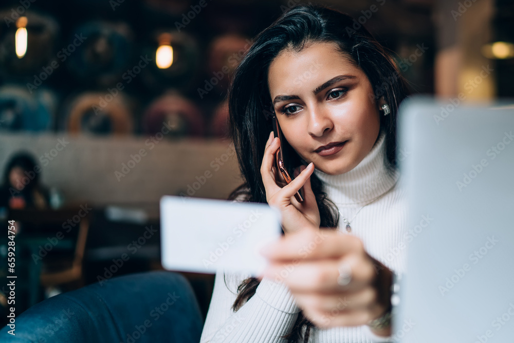 Modern freelancer holding business card in hand Modern freelancer holding business card in hand