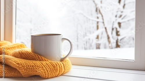 Winter holidays, calm and cosy home, cup of tea or coffee mug and knitted blanket near window in the English countryside cottage, holiday atmosphere