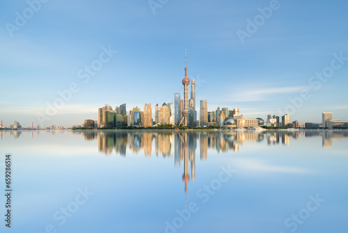 Illuminated Shanghai Skyline Reflecting On River 