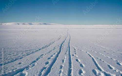 Skier on Snowy Surface at Dusk 