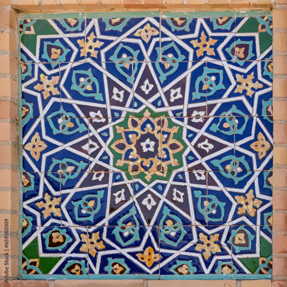 Traditional Uzbek pattern on the ceramic tile on the wall of the mosque. Samarkand, Uzbekistan