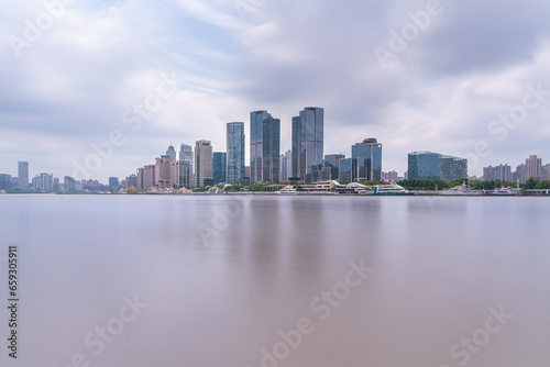 financial district buildings of shanghai and the yacht docked at the dock © shengyi