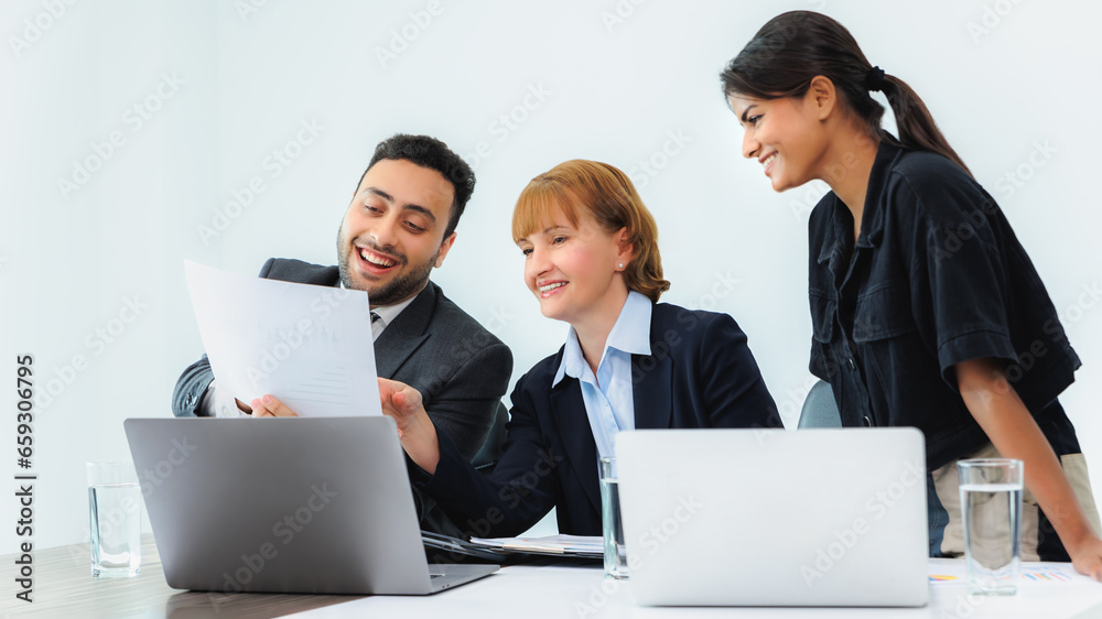 Three smiling diverse business colleagues having business strategy meeting. Three smiling diverse business colleagues having business strategy meeting.