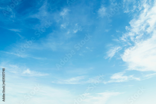 Blue sky with white clouds float in the sky on clear day with warm sunshine combined with cool breeze blowing