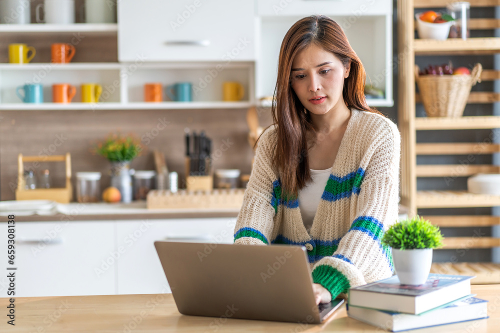 Portrait of asian woman use laptop work digital online marketing internet advertising and sales business technology concept, online marketing, E-business, Ecommerce, Business online at home Portrait of asian woman use laptop work digital online marketing internet advertising and sales business technology concept, online marketing, E-business, Ecommerce, Business online at home