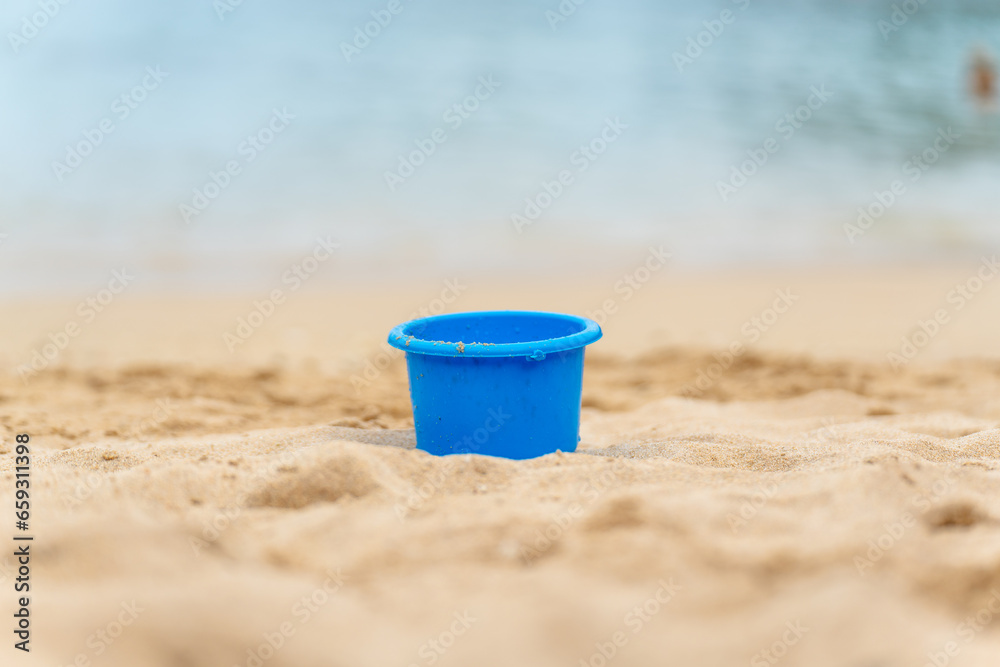bucket on the beach buried in the sand bucket on the beach buried in the sand