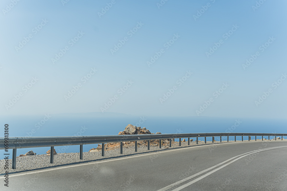 south coast of Crete, blue and crystal clear Mediterranean Sea, driving through the winding roads, we were treated to panoramic views of the surrounding landscapes. High quality photo