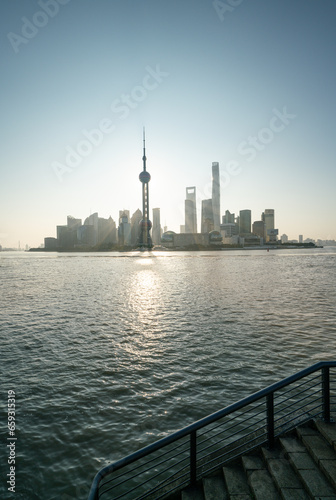 financial district buildings of shanghai and the yacht docked at the dock