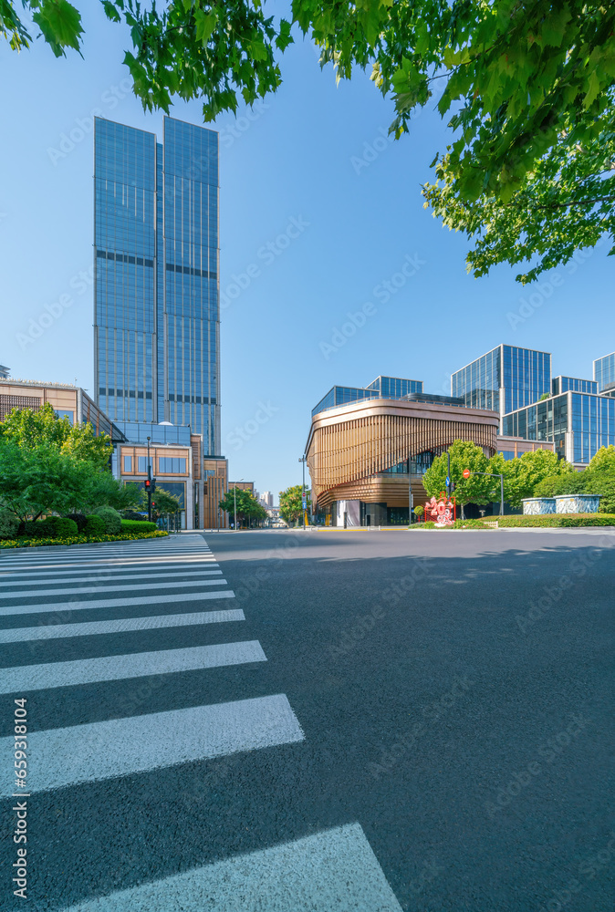 financial district buildings of shanghai and empty highway in sunny day