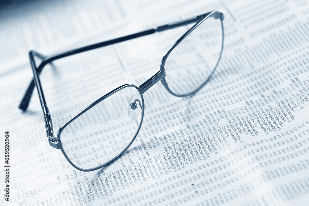 Close up of eye glasses on a business document. Close up of eye glasses on a business document.