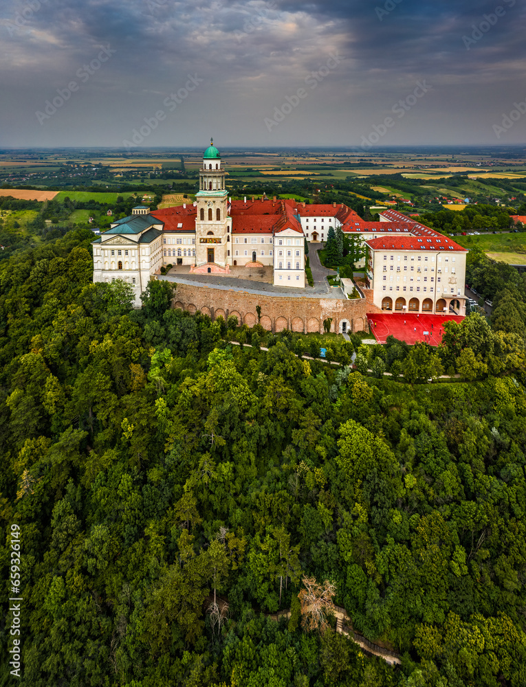 Pannonhalma, Hungary - Aerial view of the beautiful Millenary Benedictine Abbey of Pannonhalma (Pannonhalmi Apatsag) with clear blue sky and green summer foliage at summertime