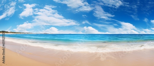 Summer Bliss: Beautiful Natural Panoramic Seascape Featuring a Golden Sandy Beach, Turquoise Sea, and Blue Sky with Clouds on a Bright Sunny Day