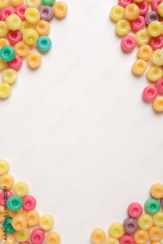 Fototapeta premium COLORED CANDIES ON A WHITE BACKGROUND