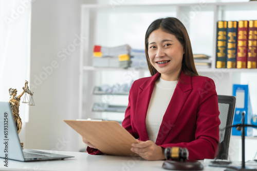 Asian female judge Asian lawyer, judge, lawyer working with legal documents Advice and concept of justice Prosecutor's Office Goddess of justice with scales and lawyer working