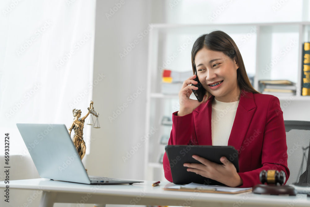 Asian female judge Asian lawyer, judge, lawyer working with legal documents Advice and concept of justice Prosecutor's Office Goddess of justice with scales and lawyer working Asian female judge Asian lawyer, judge, lawyer working with legal documents Advice and concept of justice Prosecutor's Office Goddess of justice with scales and lawyer working