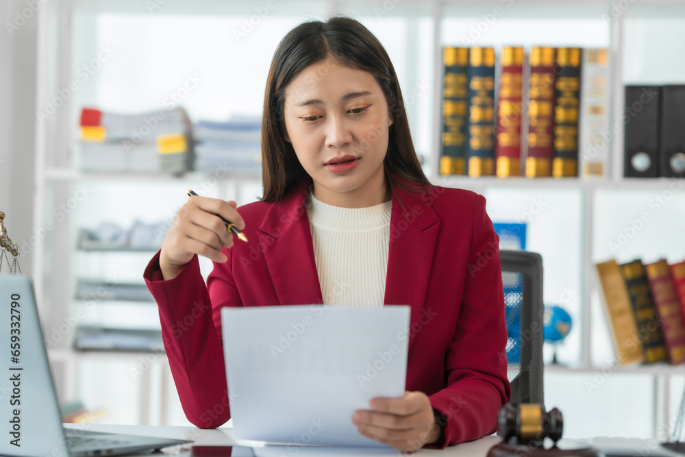 Asian female judge Asian lawyer, judge, lawyer working with legal documents Advice and concept of justice Prosecutor's Office Goddess of justice with scales and lawyer working Asian female judge Asian lawyer, judge, lawyer working with legal documents Advice and concept of justice Prosecutor's Office Goddess of justice with scales and lawyer working