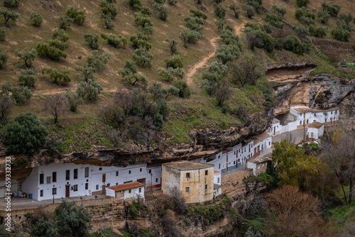 Setenil de las Bodegas, white village with its houses built into a rock mountain, Andalusia, Spain photo