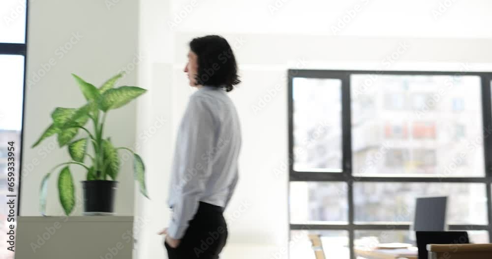 Young businessman walking around office and worrying 4k movie. Planning and ideas in business concept Young businessman walking around office and worrying 4k movie. Planning and ideas in business concept