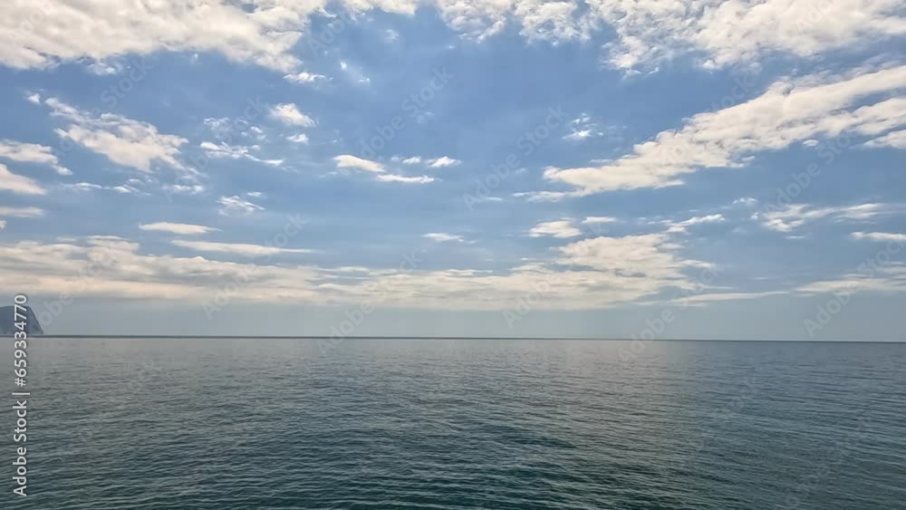 Sea water surface. Aerial view on calm water surface, camera flies over clear sea ocean. Sun glare. Abstract nautical summer ocean nature. Holiday and travel. Weather and climate change. Slow motion Sea water surface. Aerial view on calm water surface, camera flies over clear sea ocean. Sun glare. Abstract nautical summer ocean nature. Holiday and travel. Weather and climate change. Slow motion