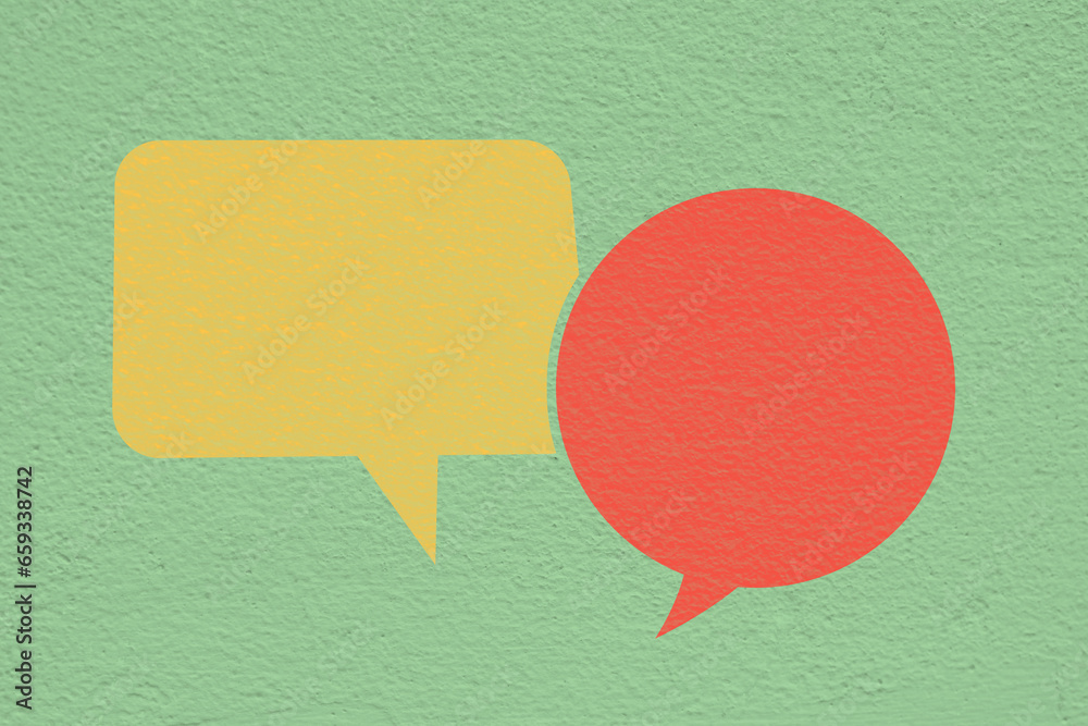 Conceptual image about communication and social media, customer feedback, Blank couple speech bubble, red and yellow on grunge green concrete wall Conceptual image about communication and social media, customer feedback, Blank couple speech bubble, red and yellow on grunge green concrete wall