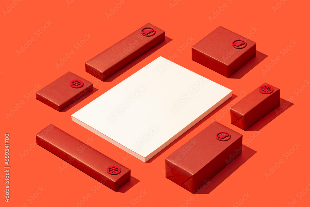 Magazine cover mockup on red background with red gift boxes flat lay. Magazine cover mockup on red background with red gift boxes flat lay.