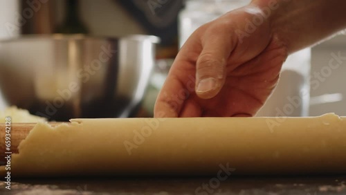 Home cooking - a man making quiche Lorraine. Low angle closeup shot.