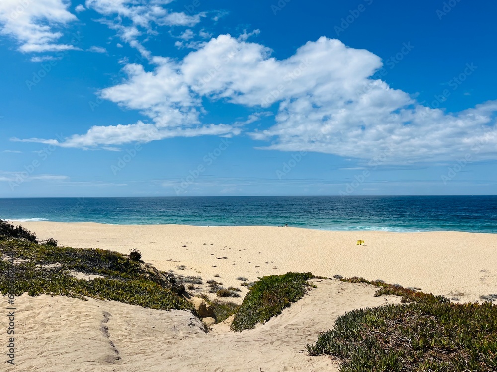 Empty sand beach, blue seashore Empty sand beach, blue seashore