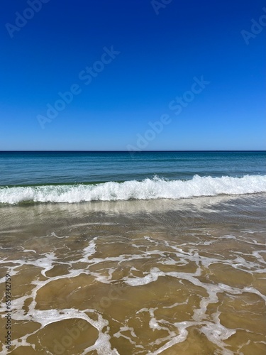 Empty sand beach, blue seashore