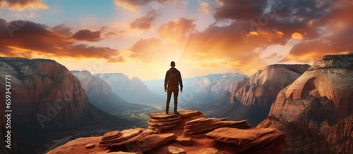 a person hiking standing on a mountain