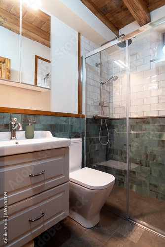 Interior of light modern bathroom in minimalist style with glass shower