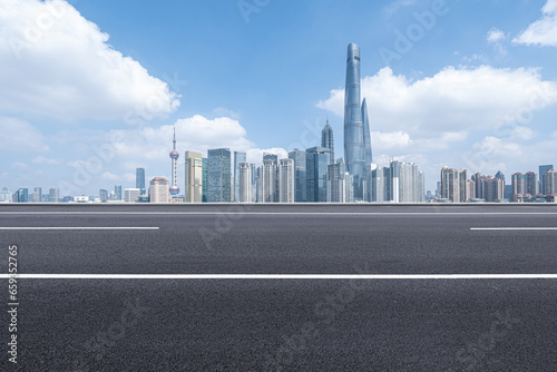 financial district buildings of shanghai and empty highway in sunny day