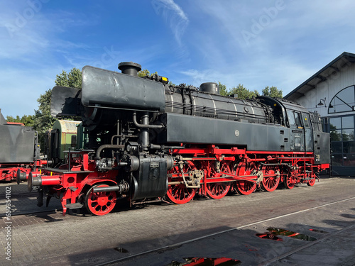 steam locomotive at an old train-station
