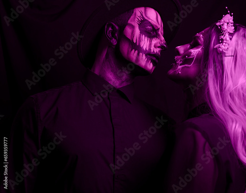 Halloween celebration. A studio shot of a young couple in festive Halloween costumes