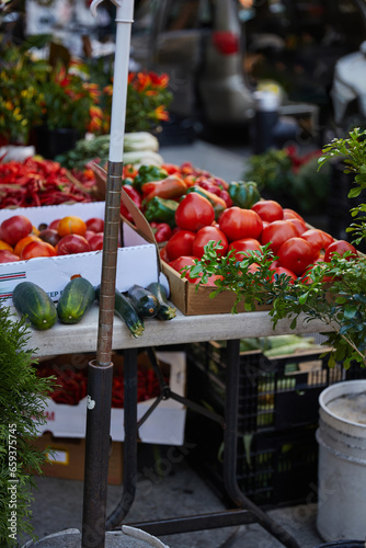 assortment of fresh vegetables and greenery on seasonal farmers market on street of new york city © LIGHTFIELD STUDIOS