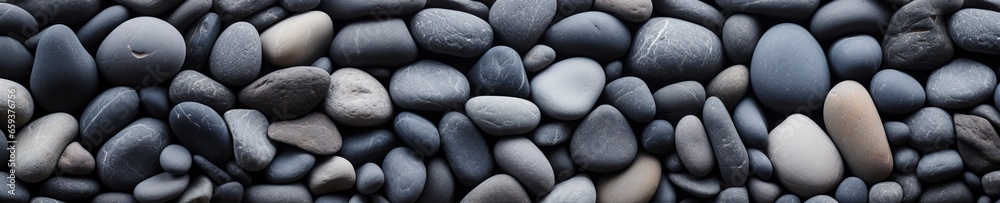 gray stone pebbles edge to edge background.